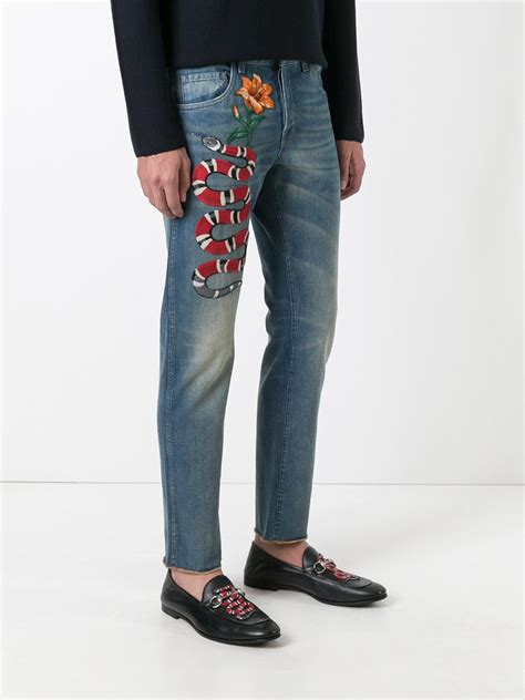 gucci jeans with snake.